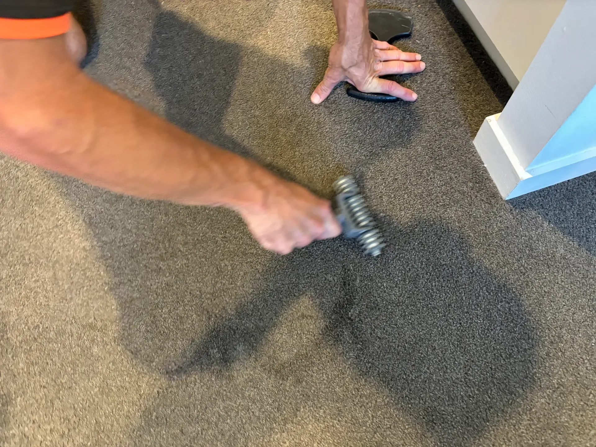 Professional carpet seam repair being performed in a Gold Coast property