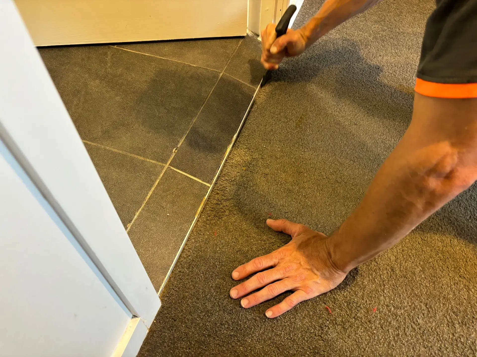 Professional carpet transition repair being completed in a Gold Coast property