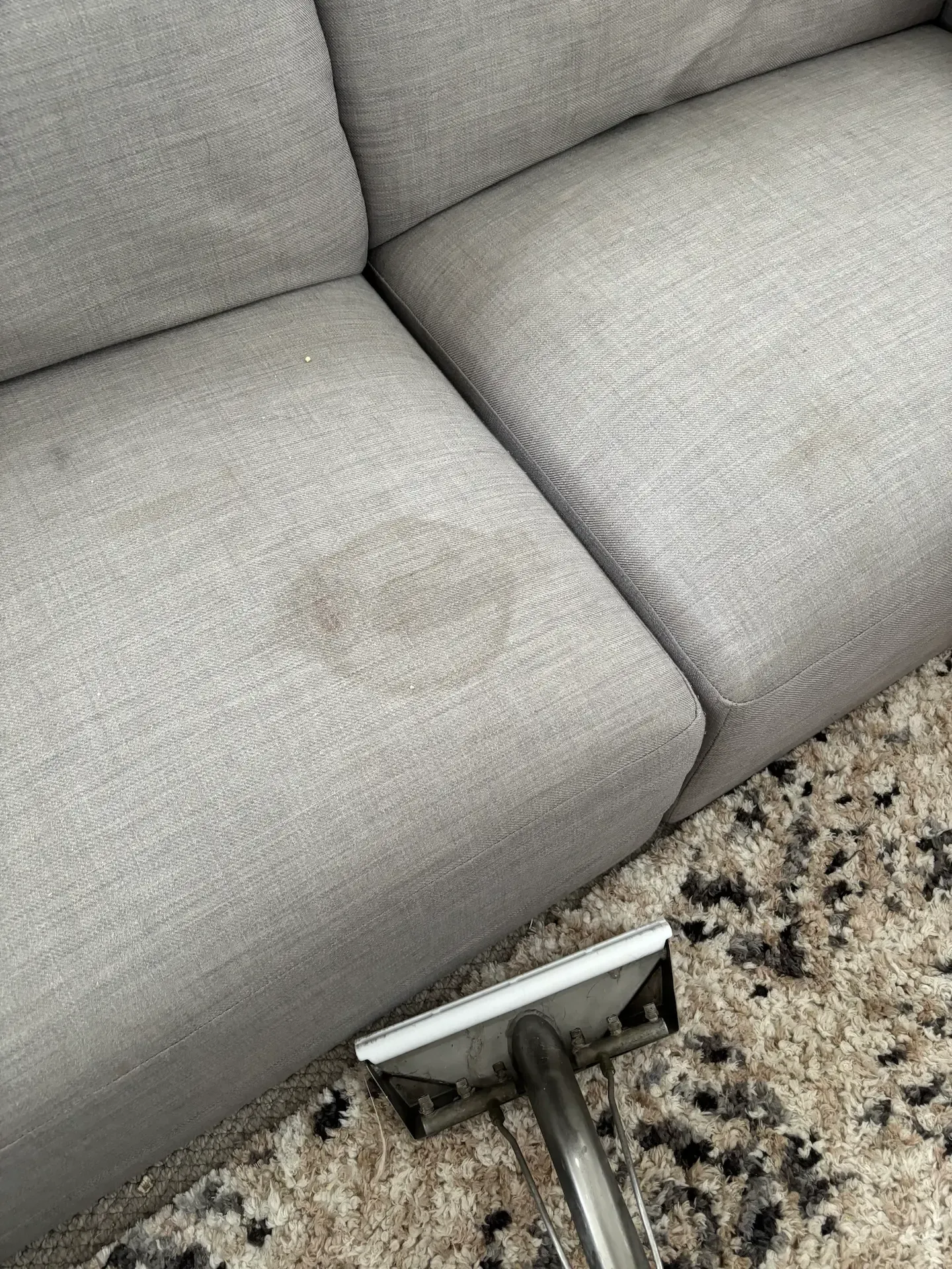 Upholstery stain before professional stain removal by The Carpet Surgeon Gold Coast