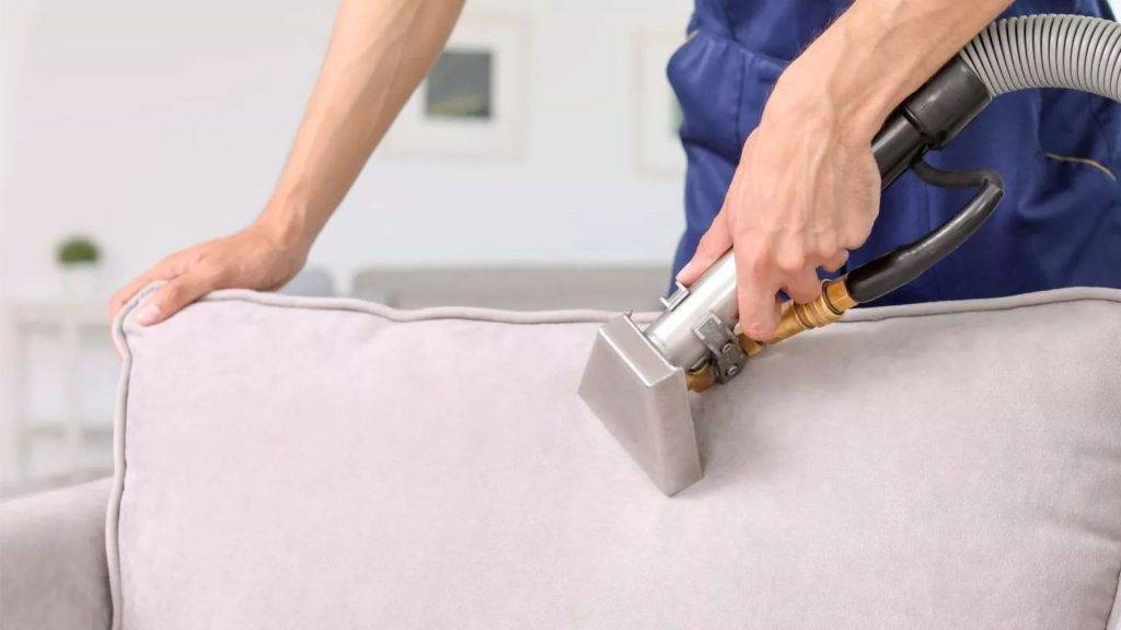 Professional carpet cleaning gold coast and licensed pest control services by the carpet surgeon showing professional upholstery cleaning on lounge